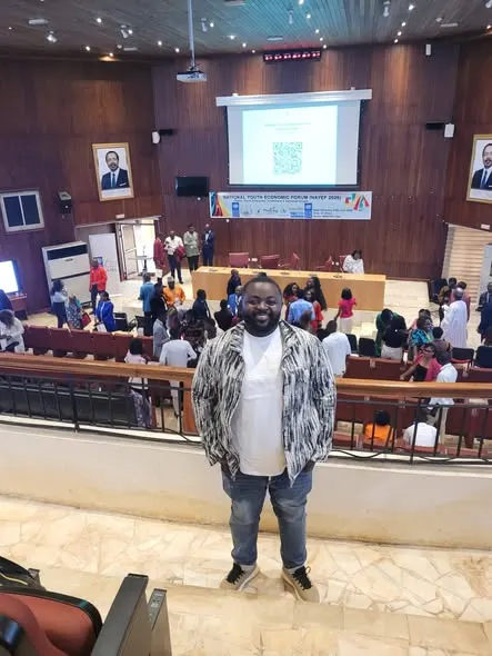 DARED's Director standing at the back of the forum auditorium